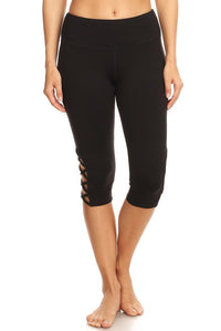 Black hi-rise Capri with a side crisscross strap cutout - Gabriel