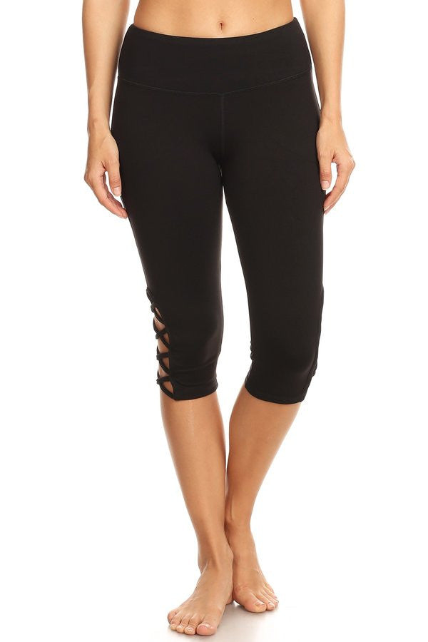 Black hi-rise Capri with a side crisscross strap cutout - Gabriel